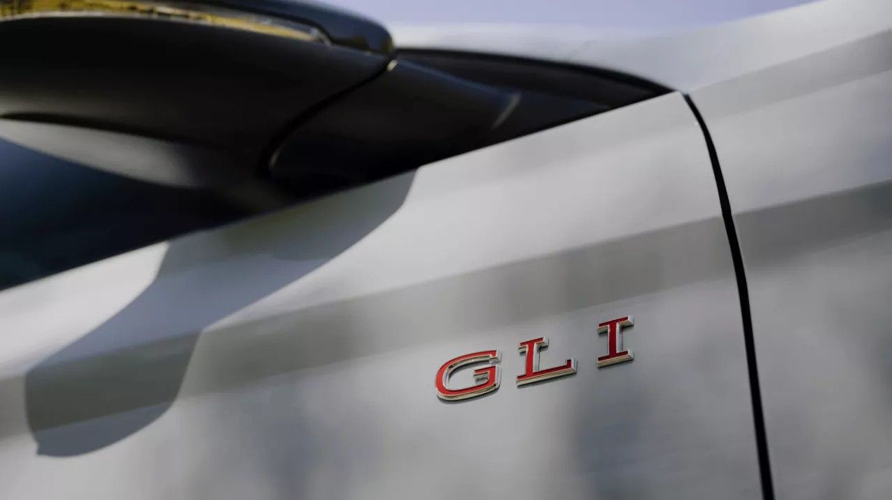Close-up of GLI badge on Jetta trunk highlighting sport trim identity.