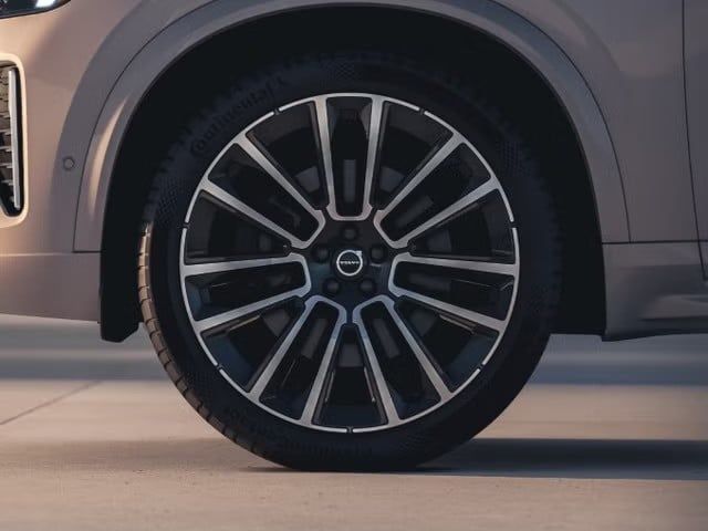  A close-up of the multi-spoke, two-tone alloy wheel and tire on the Volvo EX90.
