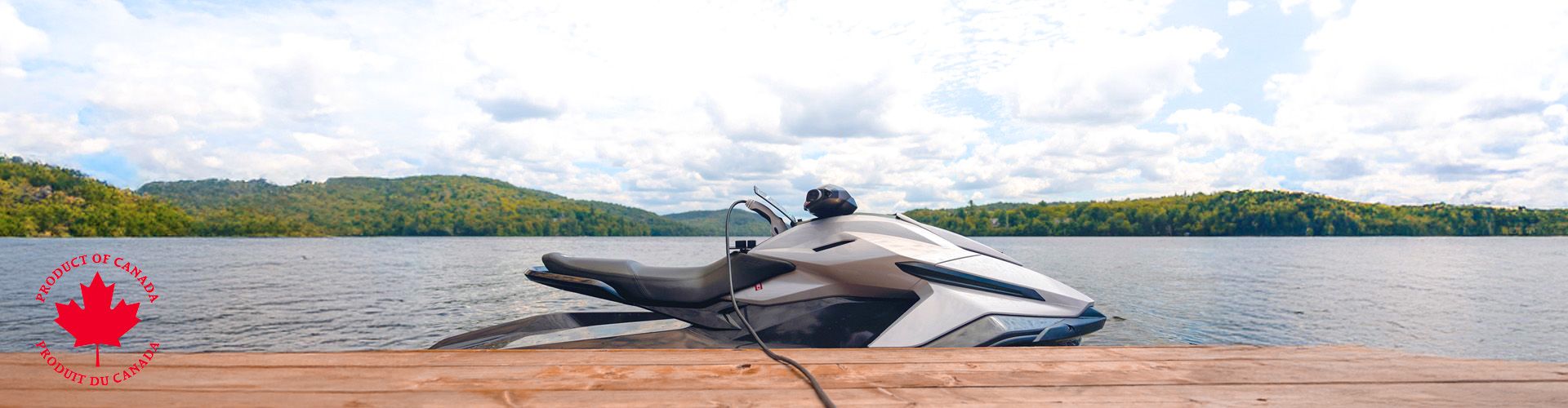 White jet ski charging on a wooden dock on a lake under a cloudy sky.	