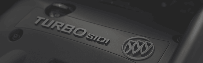 Close-up of a Buick engine cover displaying the Turbo SIDI lettering and logo.