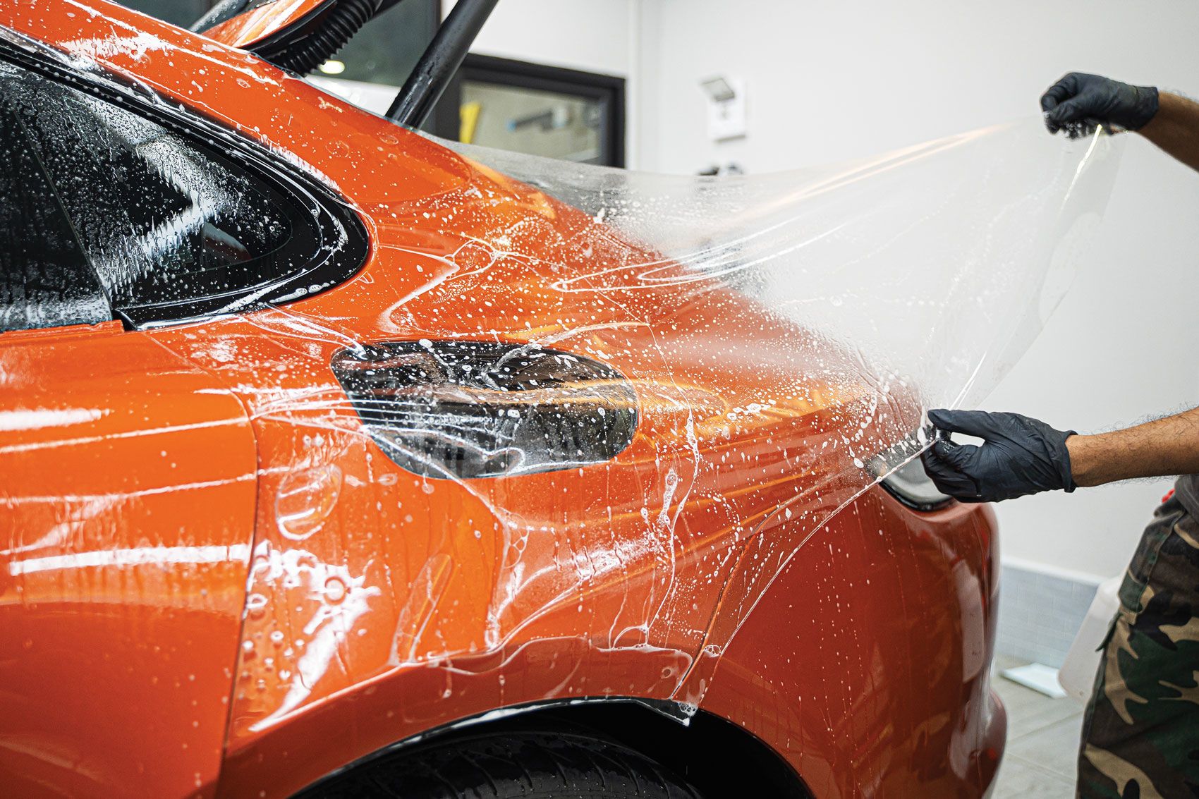 Aerial view of three cars on a winding road, demonstrating active safety and distance sensors.