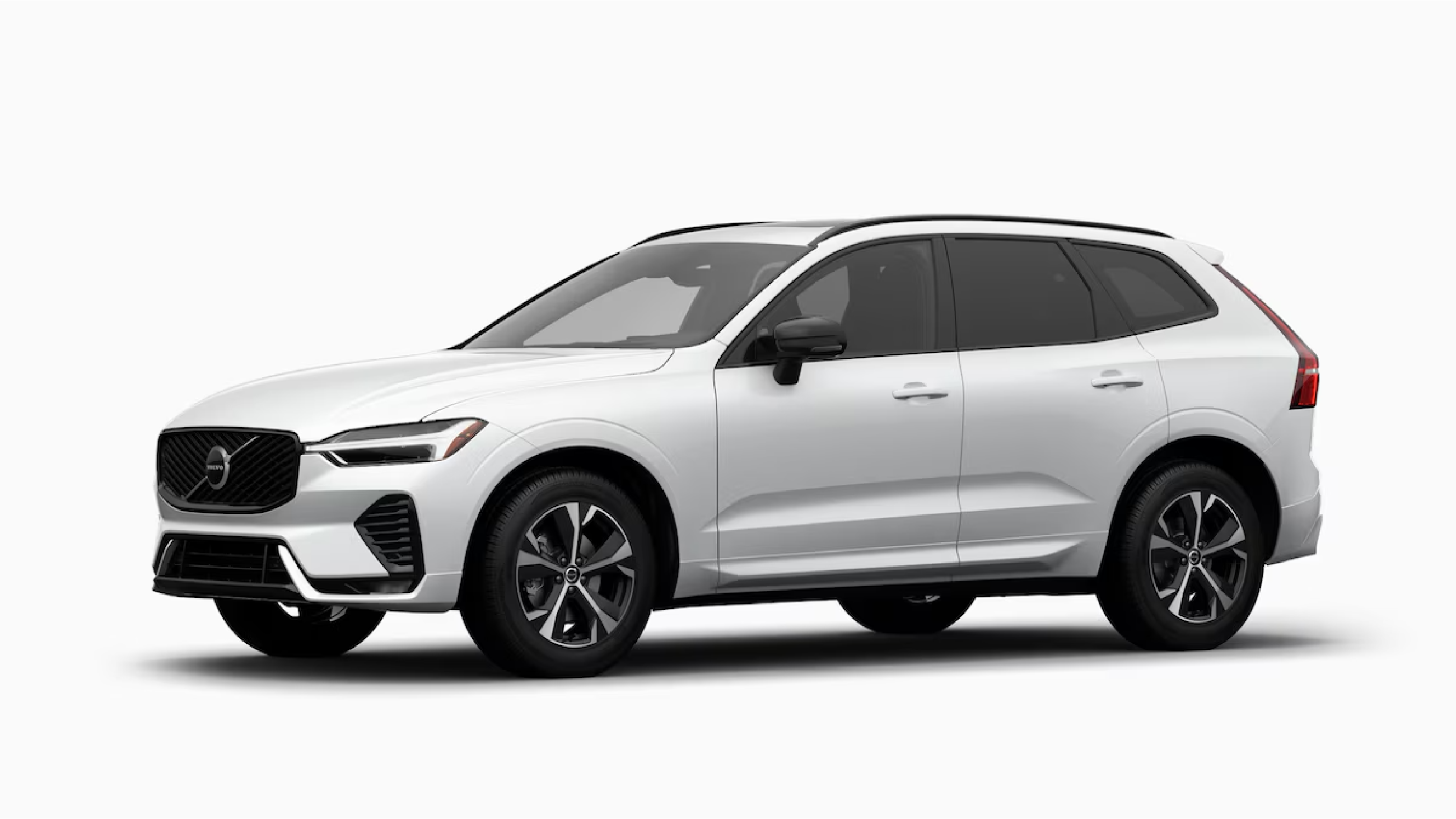 Studio profile view of a white Volvo XC60 mid-size SUV, featuring a panoramic roof, signature LED headlights, and sporty alloy wheels on a white background.