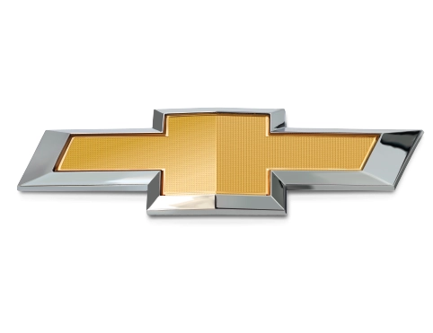 Emblème classique en forme de nœud papillon doré et chromé de Chevrolet.