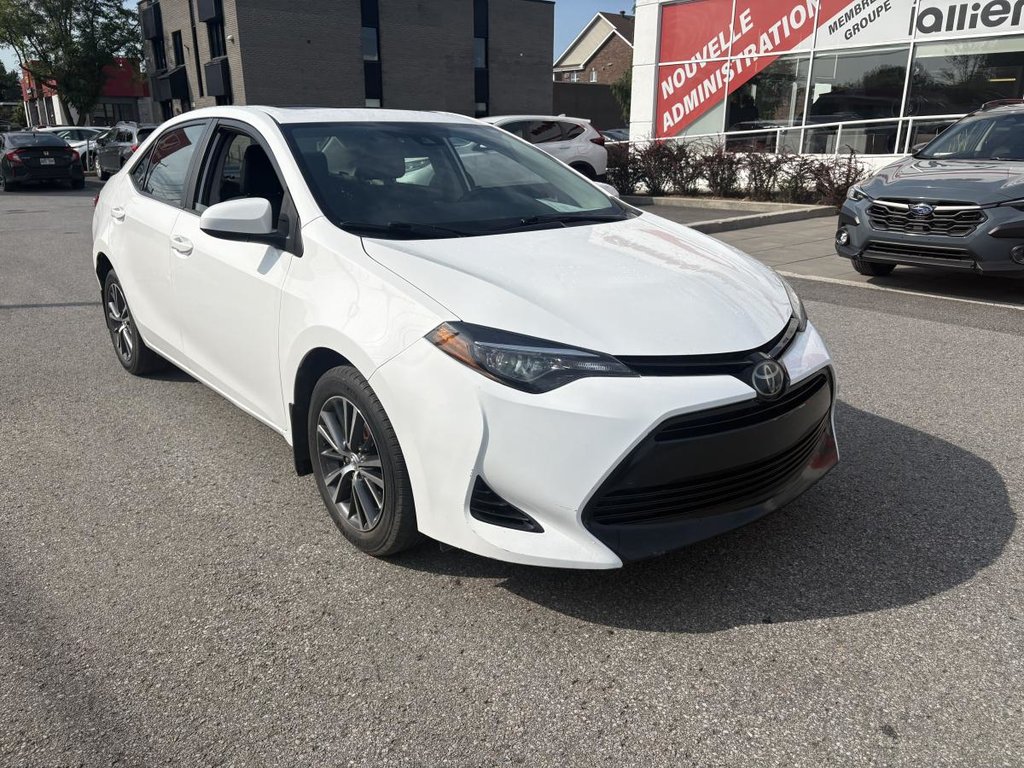 2018 Toyota Corolla LE 70,000 KM I HEATED SEATS AND STEERING WHEEL I CAMERA  I SUNROOF I MAGS I  ACTIVE SECURITY in Montréal, Quebec - 2 - w1024h768px