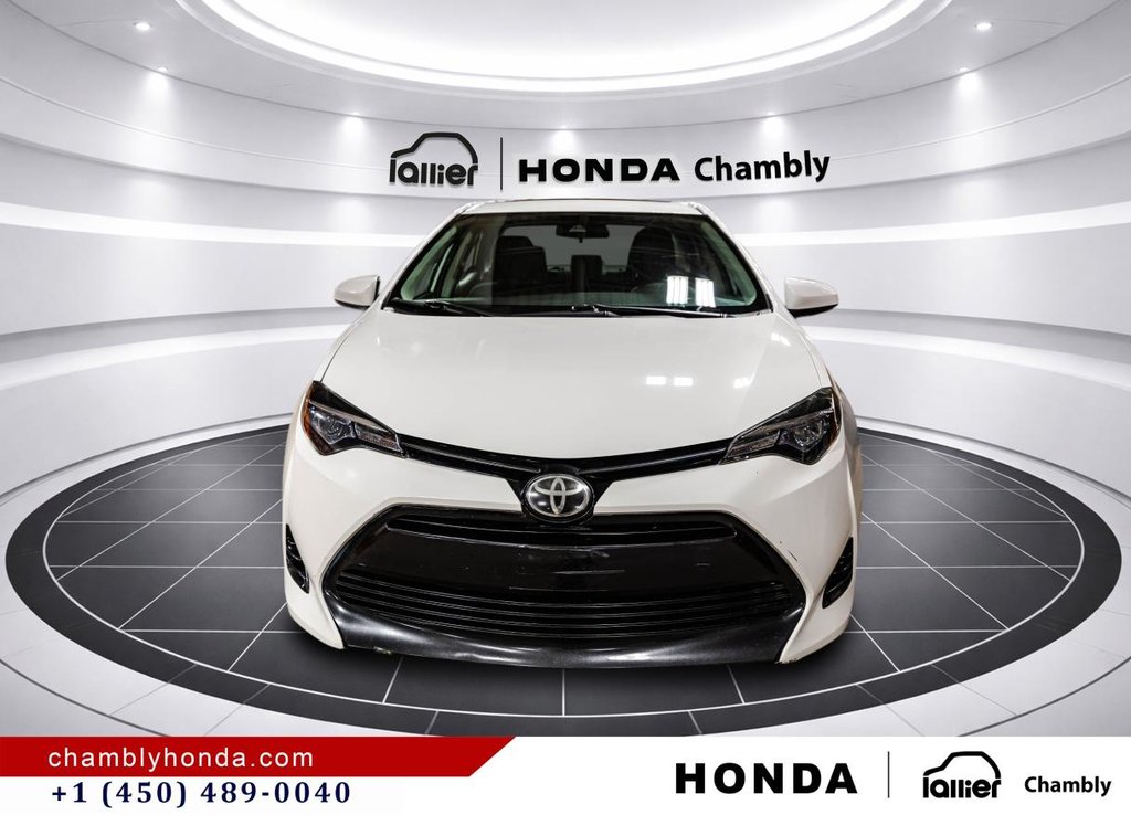2018 Toyota Corolla LE 70,000 KM I HEATED SEATS AND STEERING WHEEL I CAMERA  I SUNROOF I MAGS I  ACTIVE SECURITY in Montréal, Quebec - 2 - w1024h768px