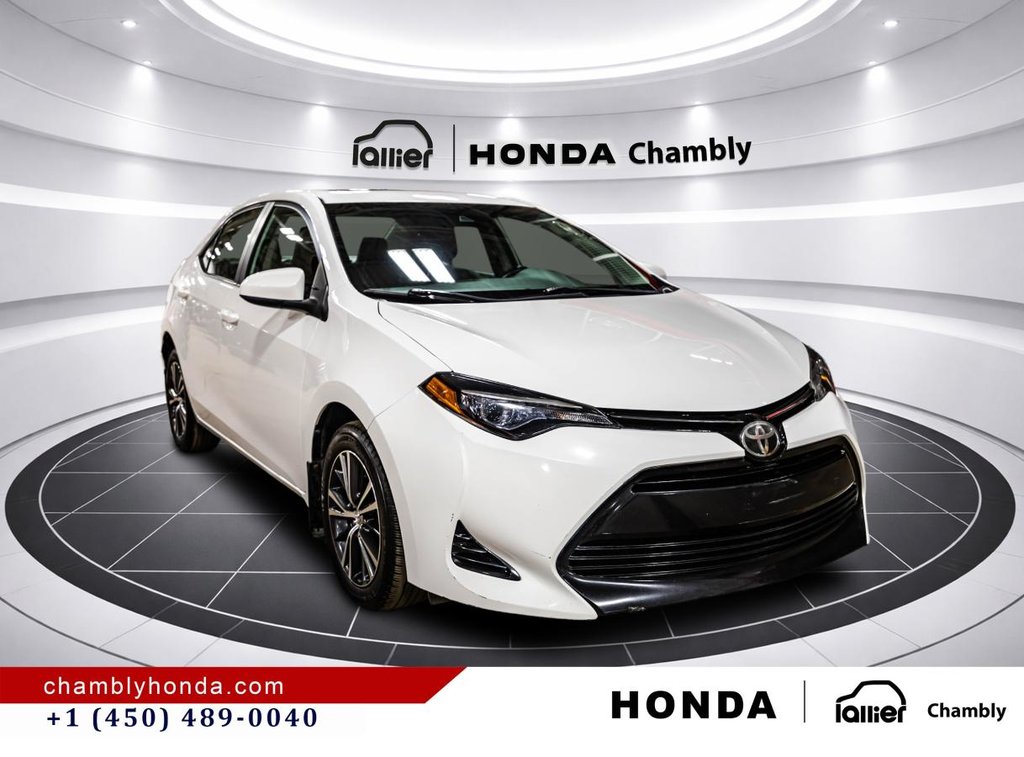 2018 Toyota Corolla LE 70,000 KM I HEATED SEATS AND STEERING WHEEL I CAMERA  I SUNROOF I MAGS I  ACTIVE SECURITY in Montréal, Quebec - 9 - w1024h768px