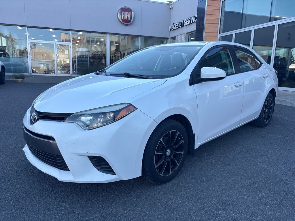2016 Toyota Corolla in Pointe-Aux-Trembles, Quebec - 1 - w1024h768px