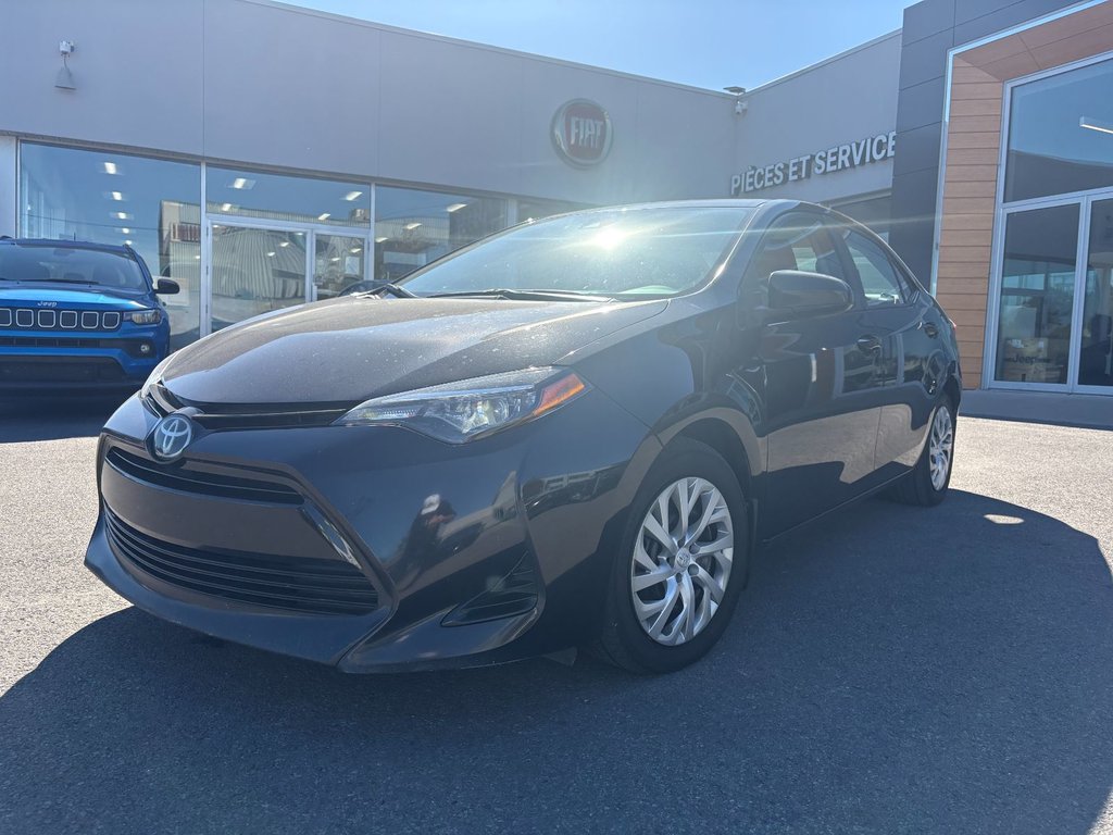 2017 Toyota Corolla in Pointe-Aux-Trembles, Quebec - 1 - w1024h768px