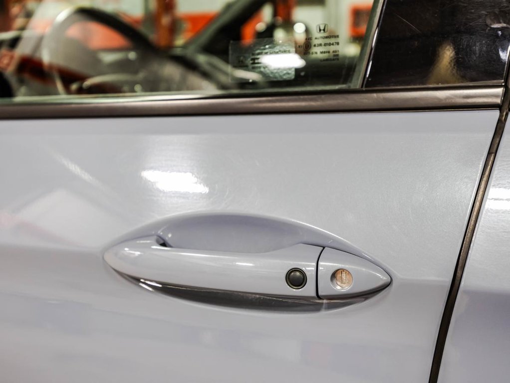 2022 Honda Passport Touring AWD I TOIT OUVRANT I CUIR I MAGS I CARPLAY I DEMARREUR I SIEGES ET VOLANT CHAUFFANTS in Montréal, Quebec - 11 - w1024h768px