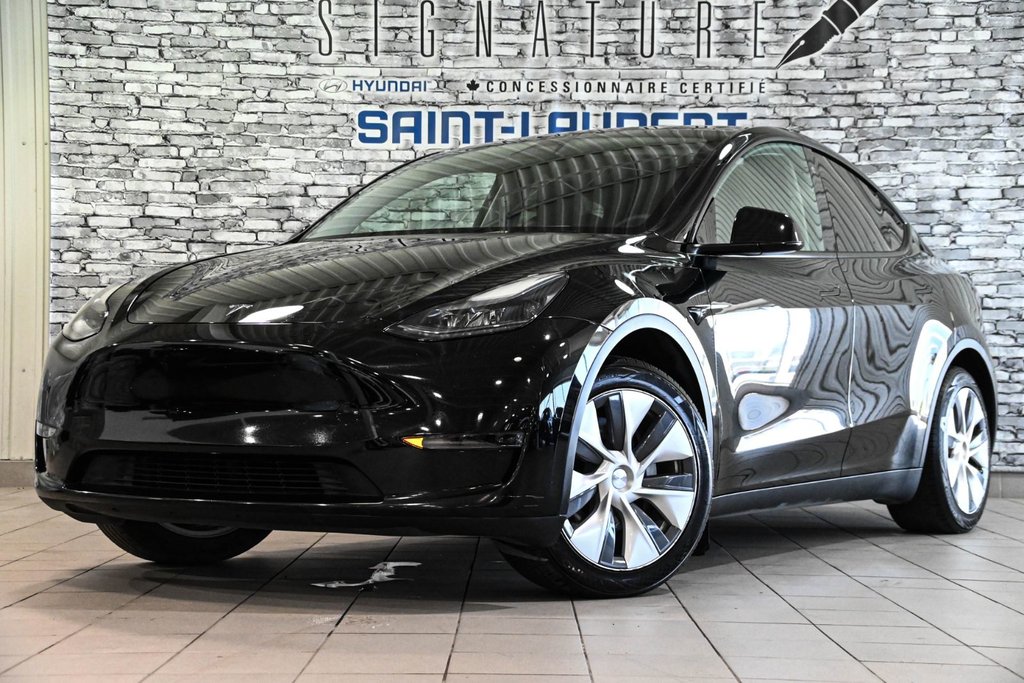 2023 Tesla Model Y STANDARD RANGE RWD CUIR TOIT PANO CAMERA in Montréal, Quebec - 1 - w1024h768px