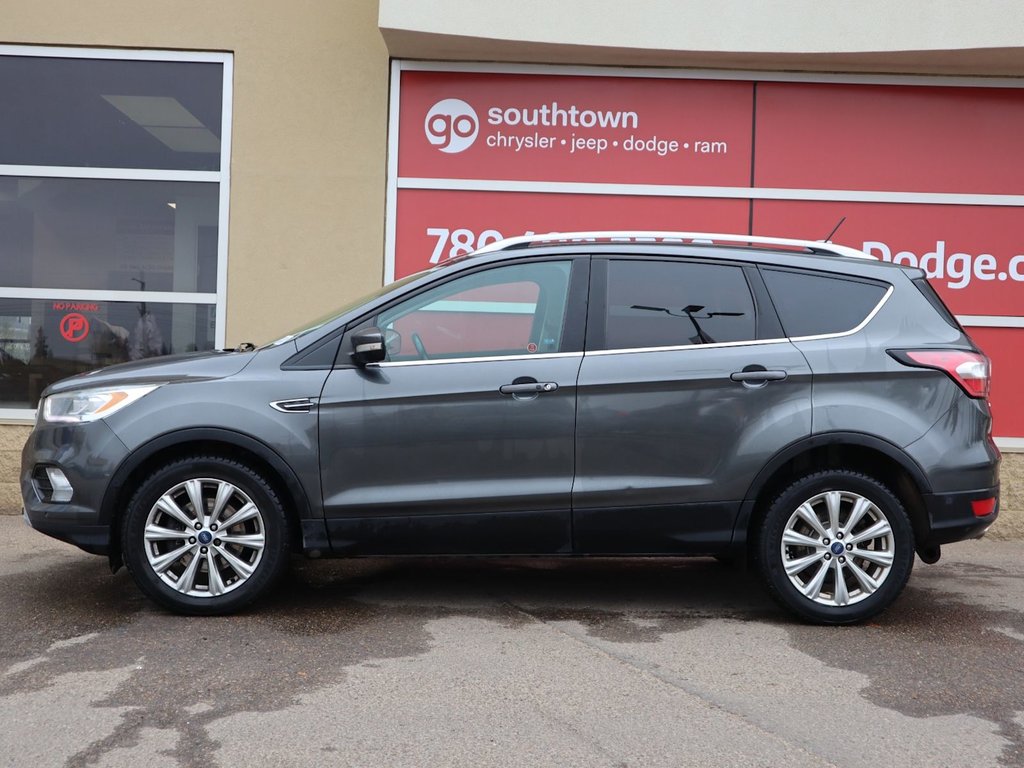 2018 Ford Escape TITANIUM IN GREY EQUIPPED WITH A 2.0L TURBO I4 , 4WD , 6SPD AUTO ,  LEATHER , PANO ROOF, NAV, REMOTE START , PREMIUM AUDIO , DUA-4