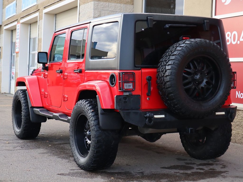 2018 Jeep WRANGLER JK UNLIMITED UNLIMITED SAHARA IN FIRECRACKER RED EQUIPPED WITH A 3.6L V6 , 4X4 , 5SPD AUTO , REMOTE START , AC , HEATED FRONT SEATS , NAV , C-7