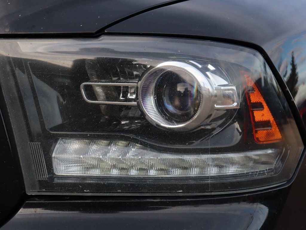 2017 Ram 1500 SPORT IN BRILLIANT BLACK EQUIPPED WITH A 5.7L HEMI V8 , 4X4 , 8SPD TF AUTO , BACKUP CAM , 121L TANK , SUNROOF , BLACK PCKG , 20I-3