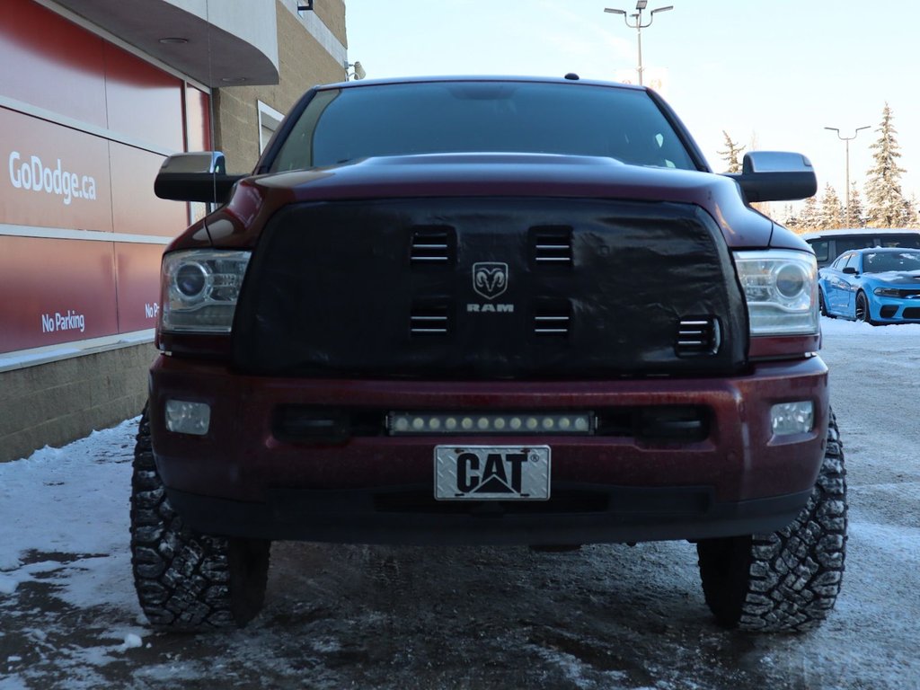 2017 Ram 2500 LIMITED MEGA CAB IN RED PEARL EQUIPPED WITH A 6.7L CUMMINS TURBO DIESEL I6 , 4X4 , 6SPD AUTO , REAR AUTO LVL AIR SUSPENSION , SU-1