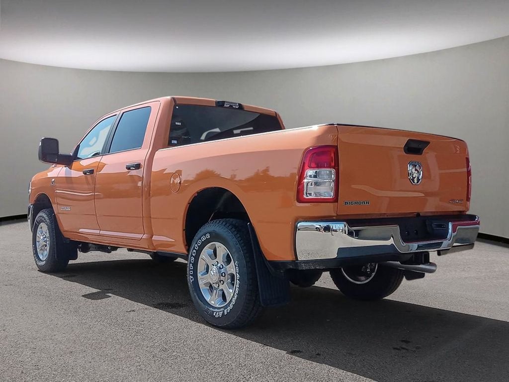 2024 Ram 3500 BIG HORN IN OMAHA ORANGE EQUIPPED WITH A 6.7L CUMMINS HO TURBO DIESEL I6 , 4X4 , 6SPD AISIN HD AUTO , 12INCH W/NAV , ALPINE AUDI-3