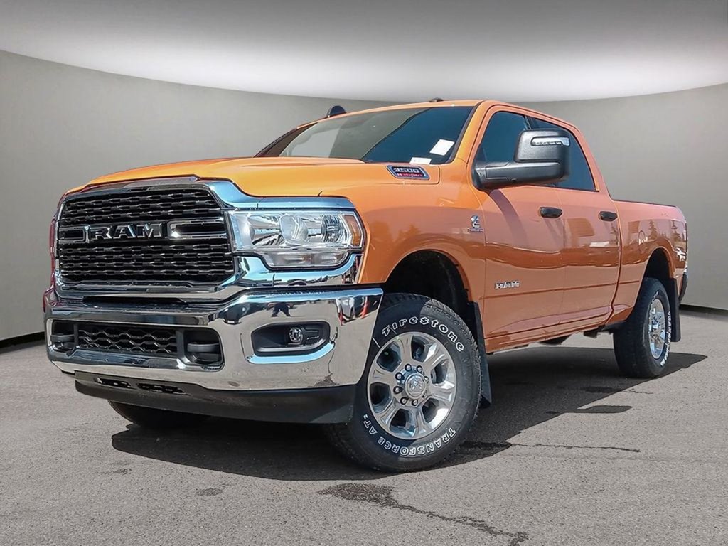 2024 Ram 3500 BIG HORN IN OMAHA ORANGE EQUIPPED WITH A 6.7L CUMMINS HO TURBO DIESEL I6 , 4X4 , 6SPD AISIN HD AUTO , 12INCH W/NAV , ALPINE AUDI-0