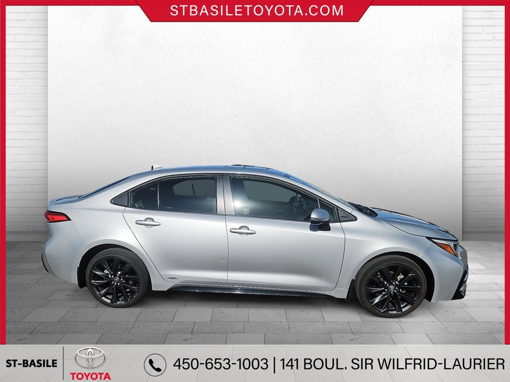 Toyota COROLLA HYBRIDE SE AWD VOLANT/SIEGES CHAUFFANTS CARPLAY 2023 à Saint-Basile-Le-Grand, Québec - 4 - w1024h768px