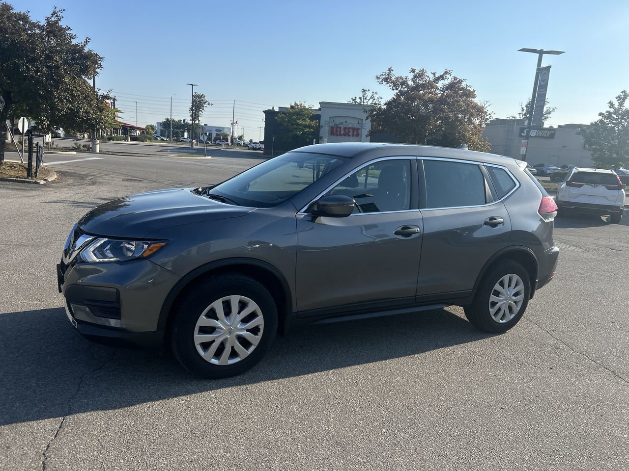 Used 2018 Gun Metallic Met Nissan S AWD CVT image 16