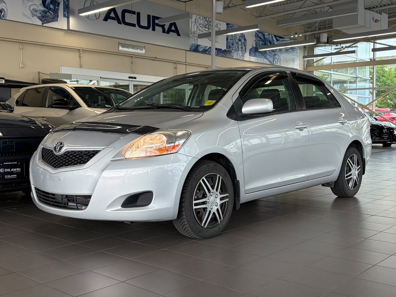 Silver 2010 Toyota Yaris Sedan Front-Wheel Drive Automatic