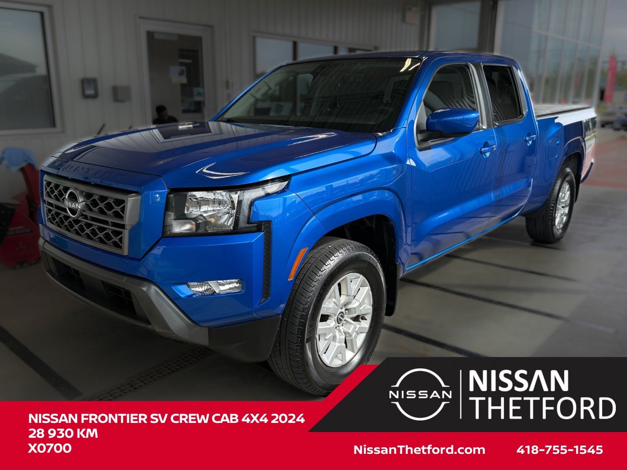 Blue 2024 Nissan Frontier Pickup Truck Four-Wheel Drive Automatic