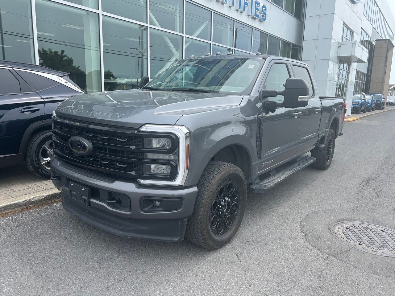 Gray 2024 Ford F-250 Super Duty Lariat Crew Cab 4WD Pickup Truck Four-Wheel Drive Automatic