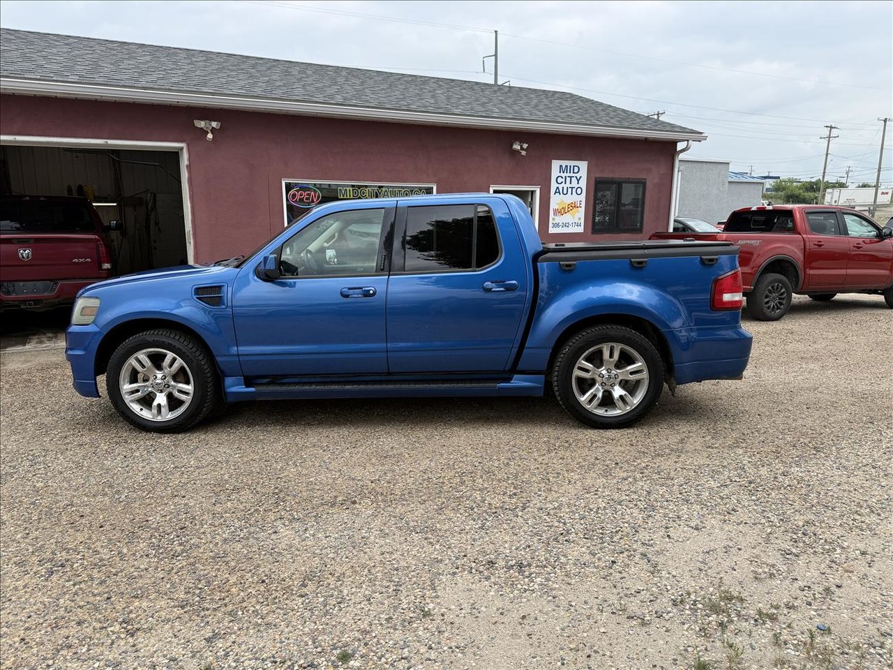 Blue 2010 Ford Explorer Sport Trac Pickup Truck All-Wheel Drive Automatic