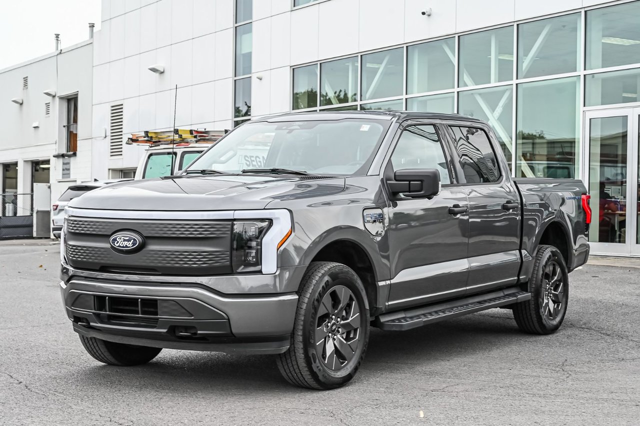 Gray (Carbonized Grey Metallic) 2024 Ford F-150 Lightning Pickup Truck All-Wheel Drive Automatic