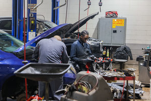 Nissan Technicians Working On Vehicles Ajax Nissan