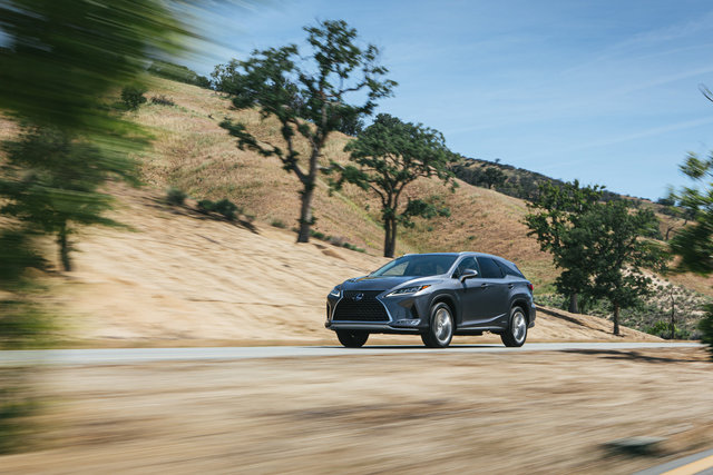 How does the hybrid system of the Lexus RX 450h 2021 work?