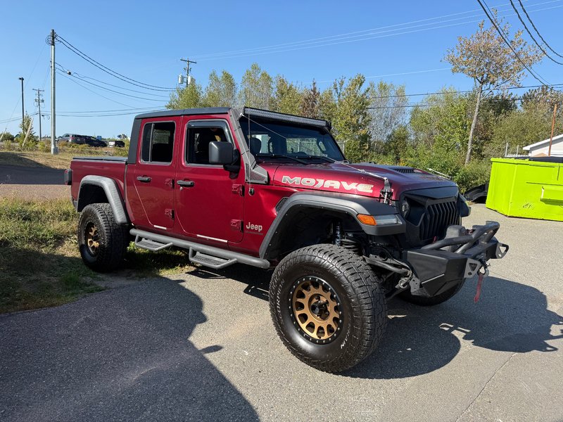 2021 Jeep Gladiator MOJAVE READY FOR WHATEVER ADVENTURE! Aftermarket wheels, bumper, side steps, and winch.