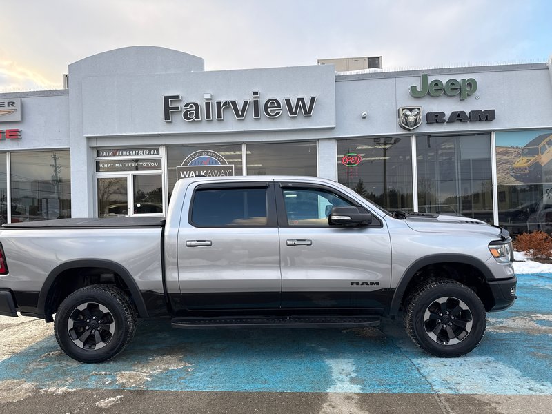 2019 Ram 1500 Rebel  aftermarket exhaust, full panel roof 12 inch screen Alpine audio much more