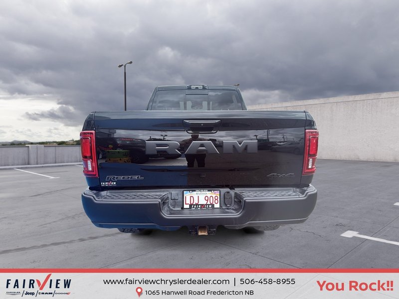 2026 Ram 2500 Rebel Three TV screens two charging stations air rise suspension MSRP 118,987