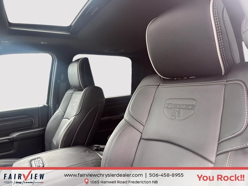2026 Ram 2500 Rebel Three TV screens two charging stations air rise suspension MSRP 118,987