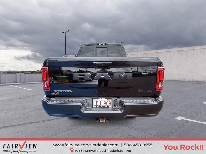 2026 Ram 2500 Rebel Three TV screens two charging stations air rise suspension MSRP 118,987