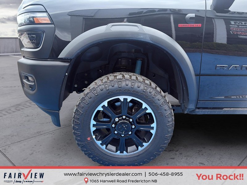2026 Ram 2500 Rebel Three TV screens two charging stations air rise suspension MSRP 118,987