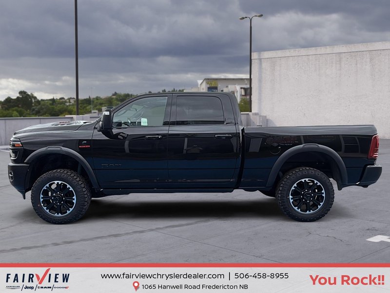 2026 Ram 2500 Rebel Three TV screens two charging stations air rise suspension MSRP 118,987
