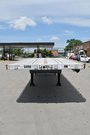 Quad-axle flatbed with a self steering for short-term rental at Location Brossard