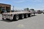 Quad-axle flatbed with a self steering for short-term rental at Location Brossard