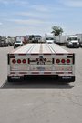 Quad-axle flatbed with a self steering for short-term rental at Location Brossard