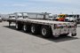 Quad-axle flatbed with a self steering for short-term rental at Location Brossard