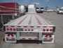 Tridem axle low-floor flatbed for short-term rental at Location Brossard