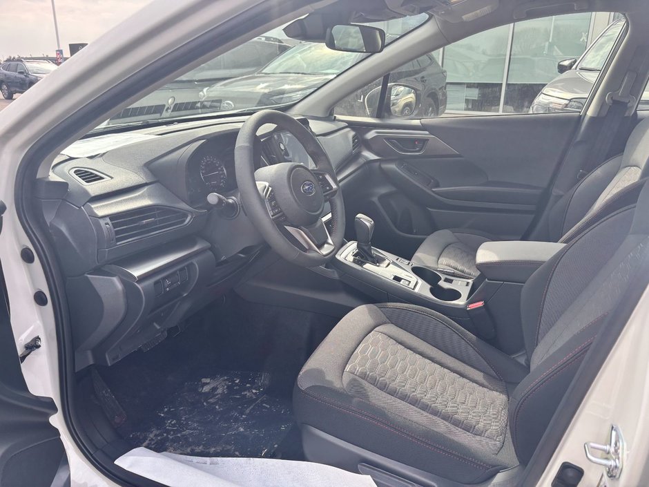 Subaru Impreza Touring 2025 Cette voiture à hayon à 5 portes est équipée de série de la traction intégrale symétrique Subaru.