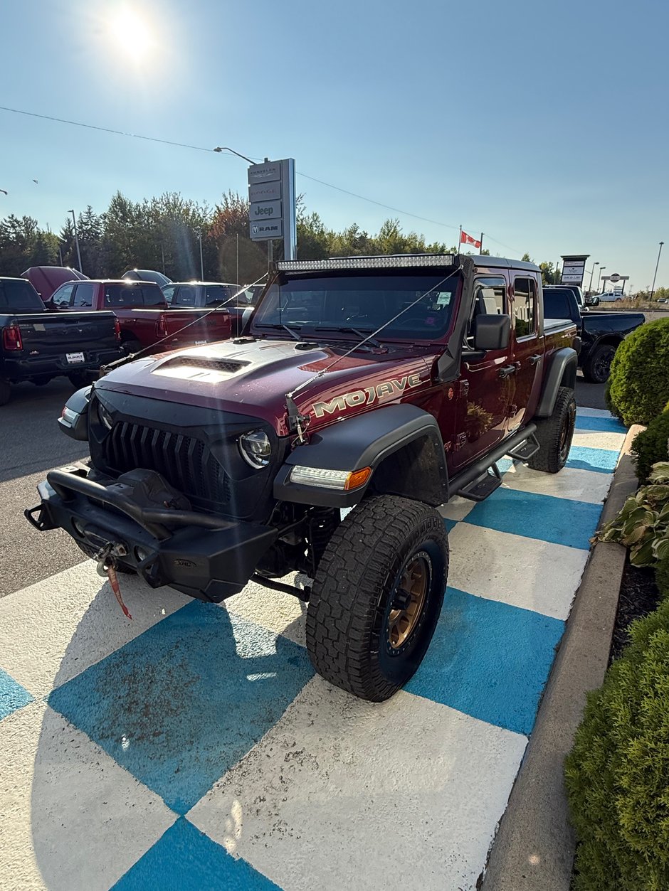 2021 Jeep Gladiator MOJAVE READY FOR WHATEVER ADVENTURE! Aftermarket wheels, bumper, side steps, and winch.