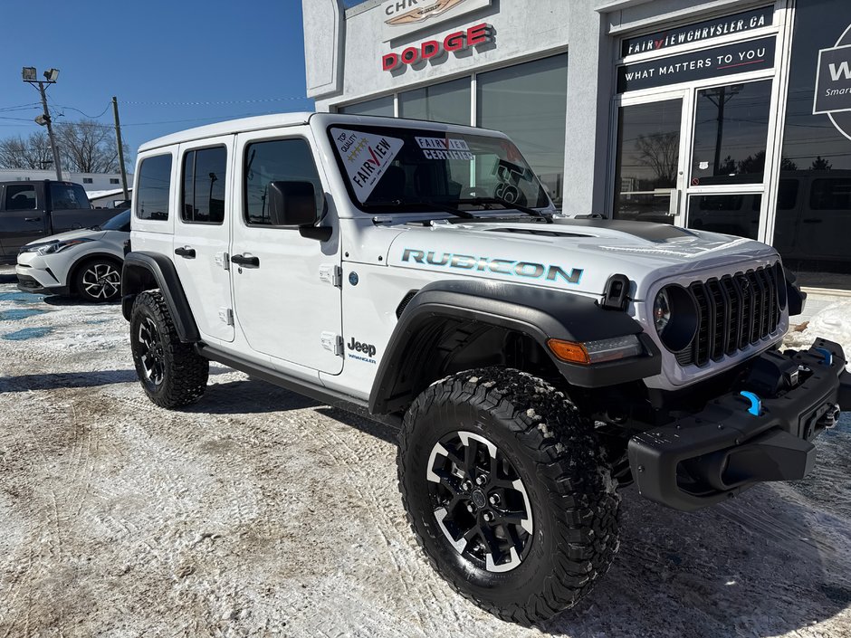 2024 Jeep Wrangler 4xe Rubicon Demo with 21,000 off sky, active roof, winch, steel bumpers sticker prices, 88K