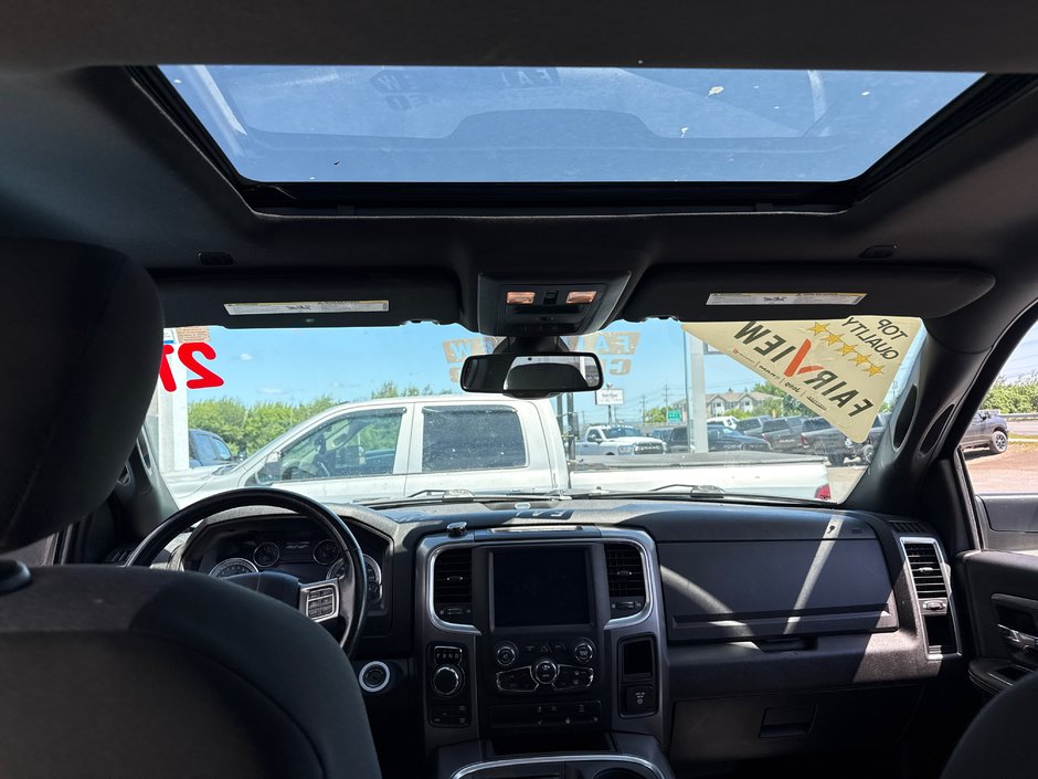 2021 Ram 1500 Classic Warlock V8 hemi Loaded with a sunroof, heated seat, heated wheel navigation, etc.