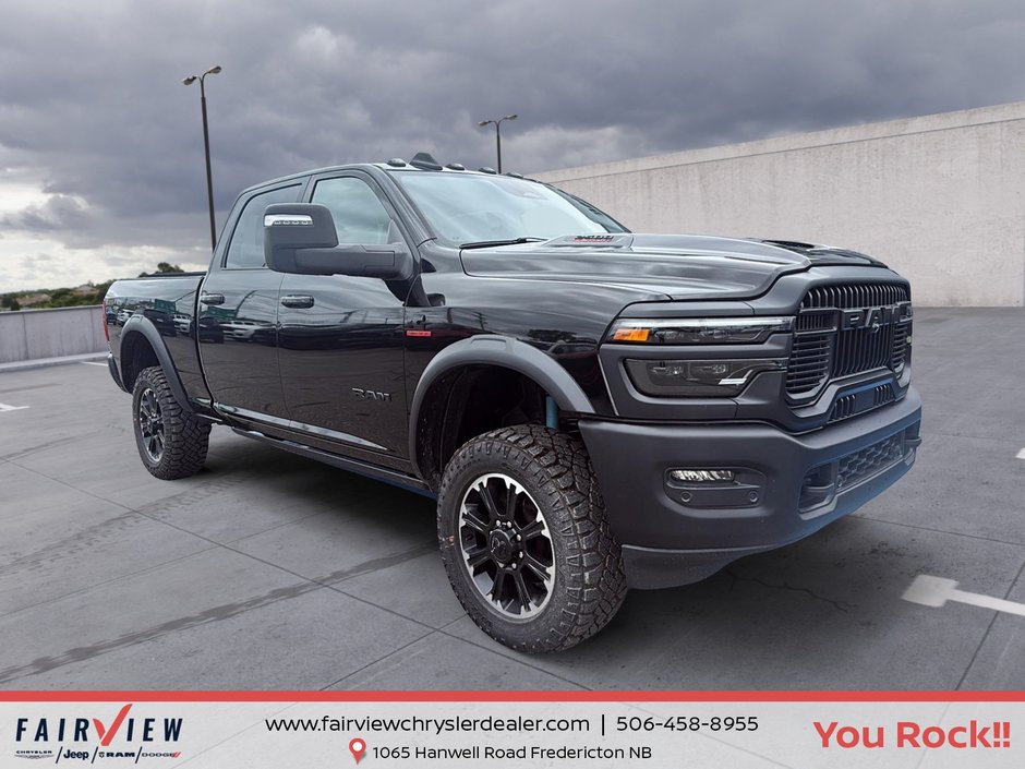 2026 Ram 2500 Rebel Three TV screens two charging stations air rise suspension MSRP 118,987