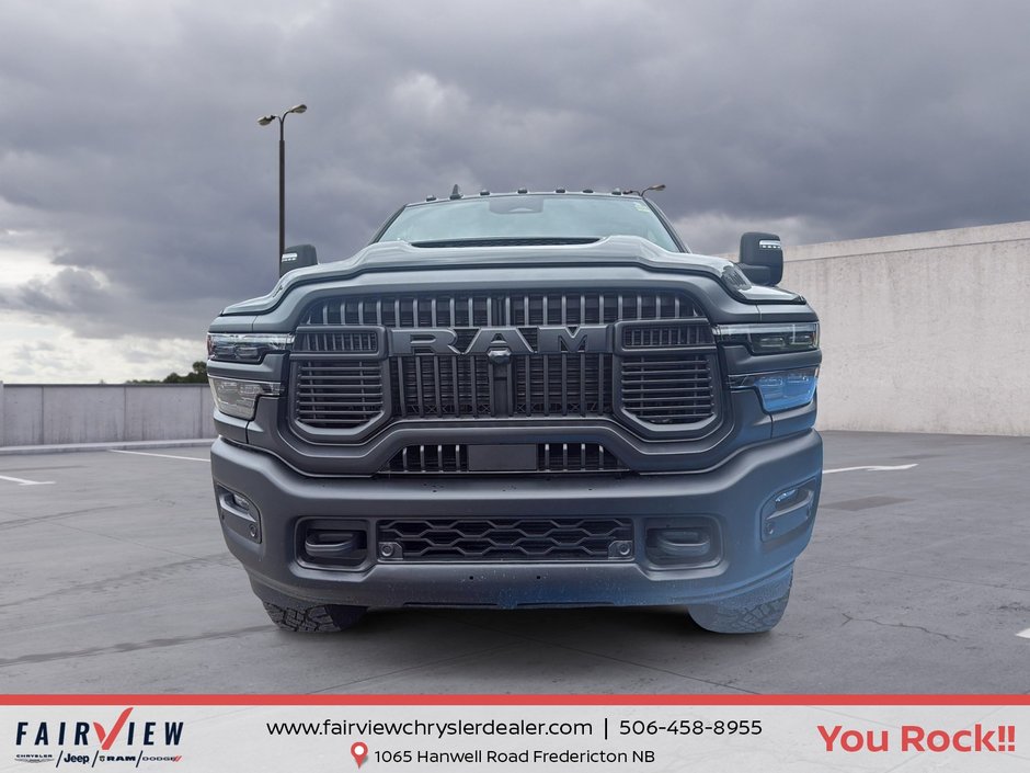 2026 Ram 2500 Rebel Three TV screens two charging stations air rise suspension MSRP 118,987