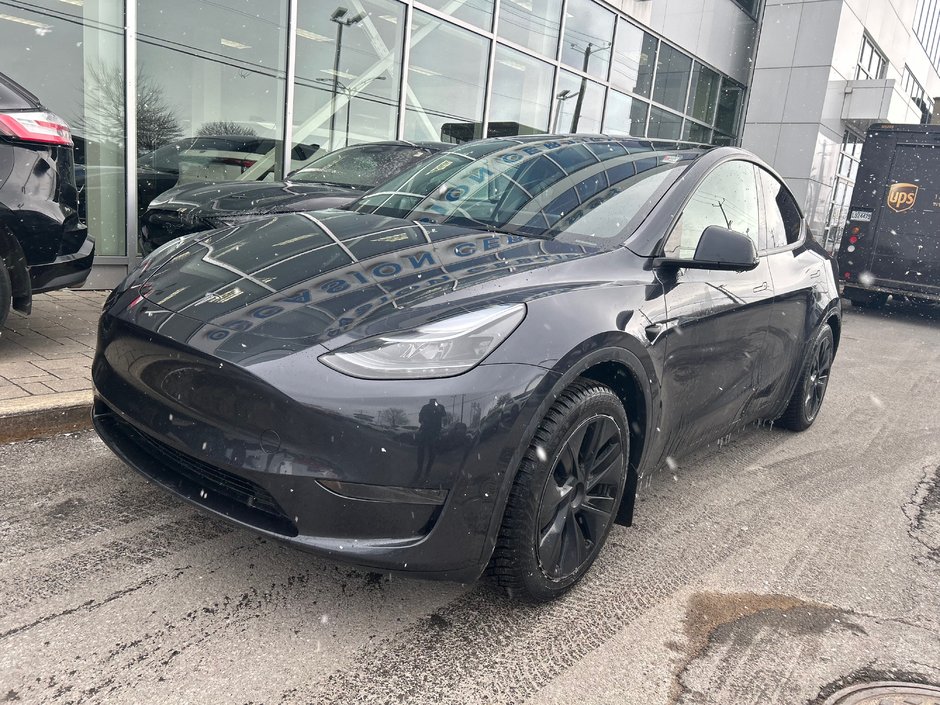 2025 Tesla Model Y in Brossard, Quebec - w940px