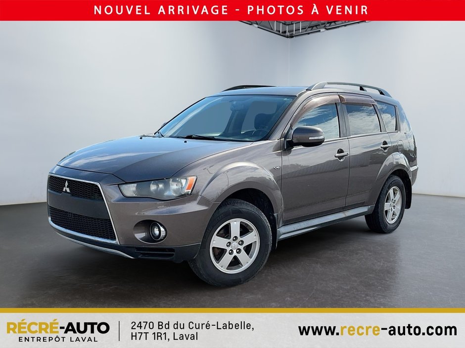 Outlander 4WD LS + BANCS CHAUFFANTS + TEL QUEL!!! 2011 à Brossard, Québec