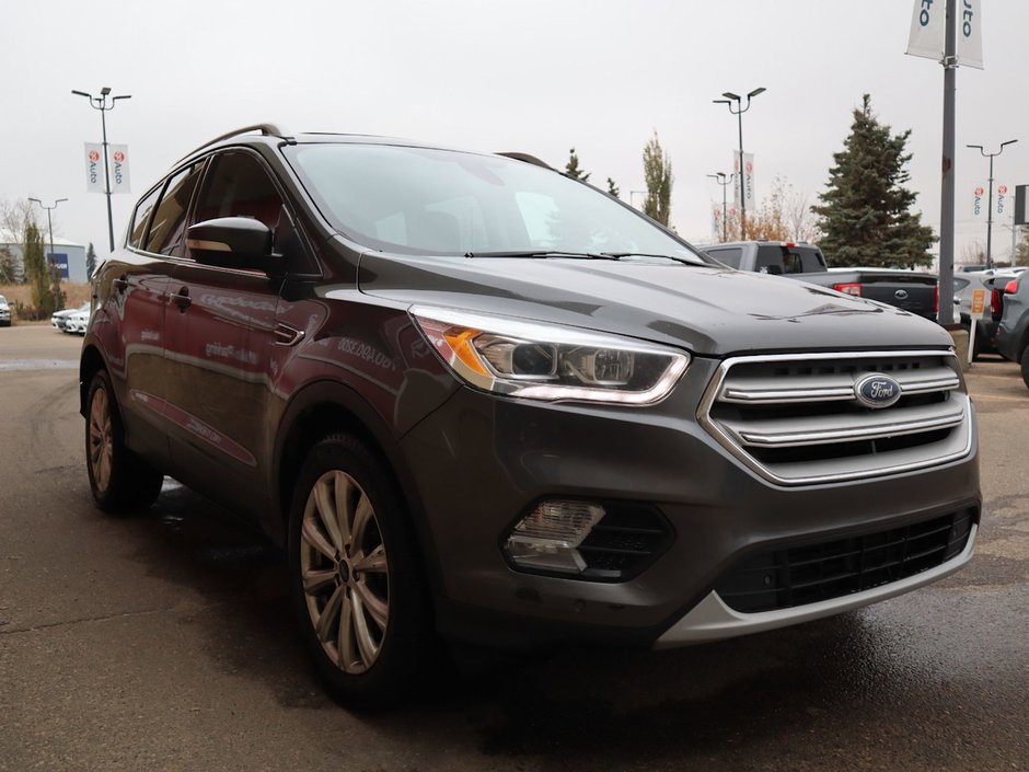 2018 Ford Escape TITANIUM IN GREY EQUIPPED WITH A 2.0L TURBO I4 , 4WD , 6SPD AUTO ,  LEATHER , PANO ROOF, NAV, REMOTE START , PREMIUM AUDIO , DUA-8